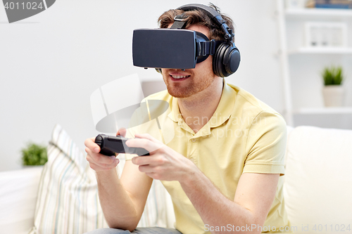 Image of man in virtual reality headset with controller