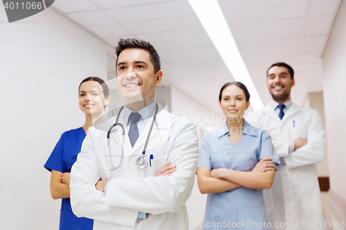 Image of group of happy medics or doctors at hospital