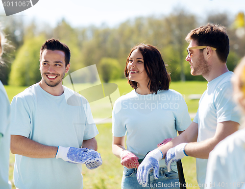 Image of group of volunteers planting tree in park
