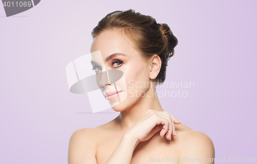 Image of beautiful young woman face over white background