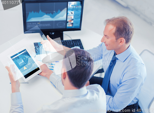 Image of businessmen with tablet pc and computer at office