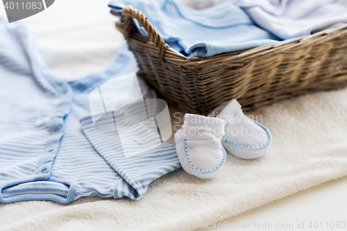 Image of close up of baby clothes for newborn boy in basket