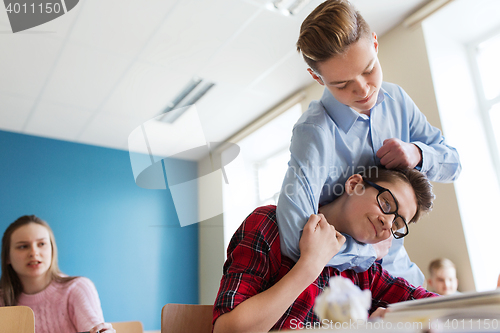 Image of student boy suffering of classmate mockery