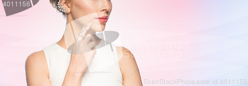 Image of close up of beautiful woman with ring and earring