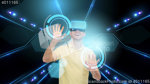 Image of happy man in virtual reality headset or 3d glasses