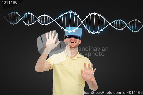 Image of happy man in virtual reality headset or 3d glasses