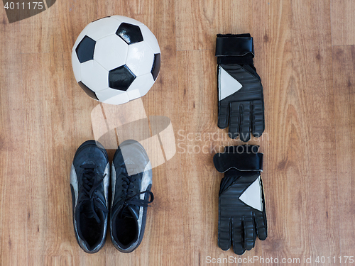 Image of close up of soccer ball, boots and gloves