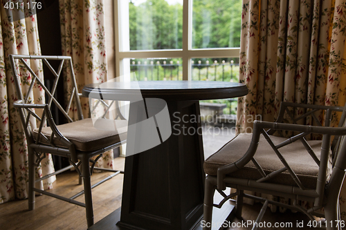 Image of close up of vintage chairs and table at home
