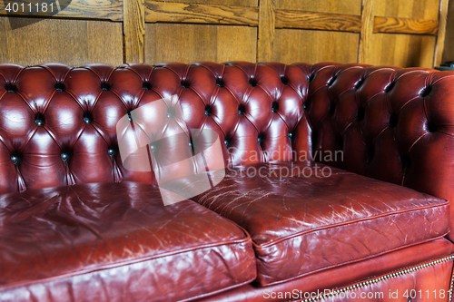 Image of close up of vintage leather sofa