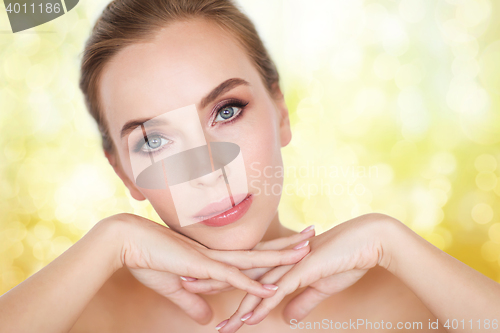 Image of beautiful young woman face and hands
