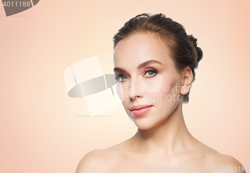 Image of beautiful young woman face over white background
