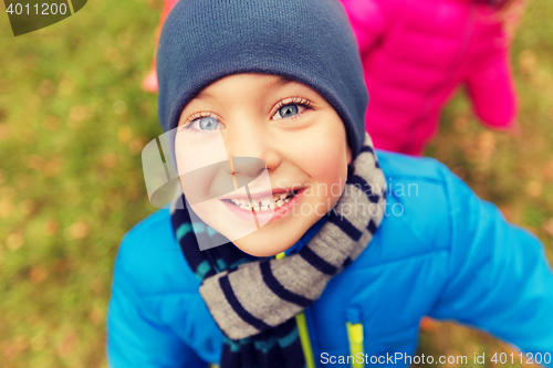 Image of happy little boy face outdoors