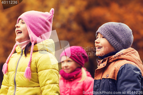 Image of group of happy children in autumn park
