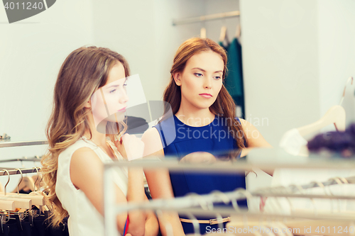 Image of women with shopping bags at clothing shop
