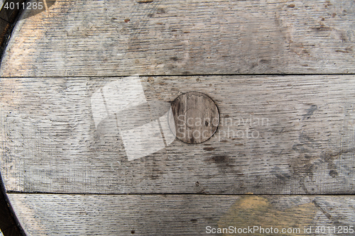 Image of close up of old wooden barrel outdoors