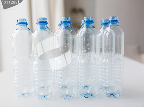 Image of close up of empty used plastic bottles on table