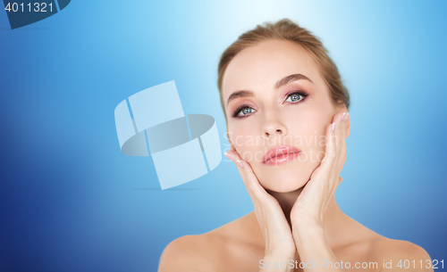 Image of beautiful young woman face and hands
