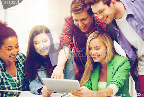 Image of students looking at tablet pc in lecture at school