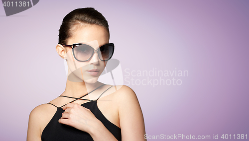 Image of beautiful young woman in elegant black sunglasses