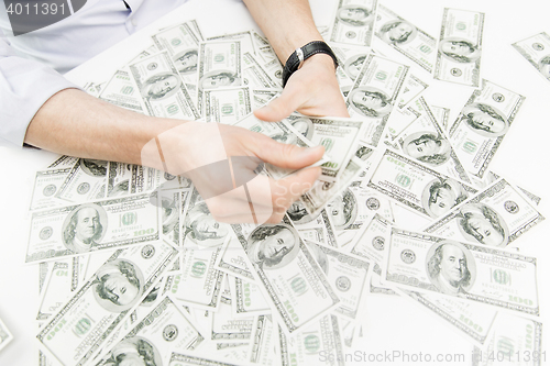 Image of close up of male businessman hands with money