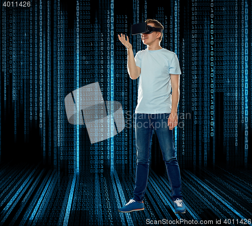 Image of happy man in virtual reality headset or 3d glasses