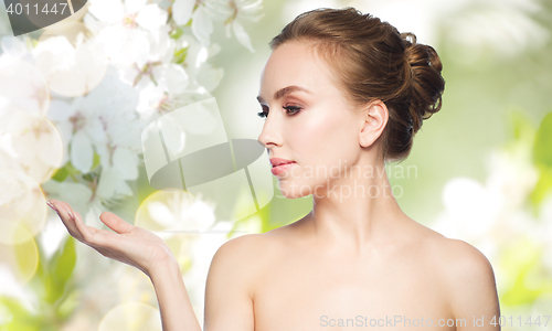 Image of smiling young woman face and shoulders