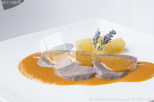 Image of beef tongue spanish traditional cuisine with wine sauce