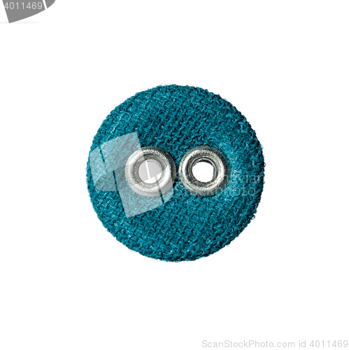 Image of round button with two holes made of fabric