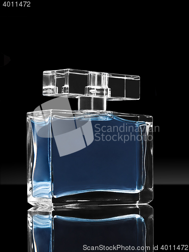 Image of blue elegant perfume bottle in black background