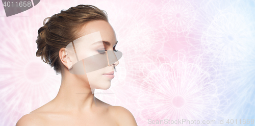 Image of beautiful young woman face over white background