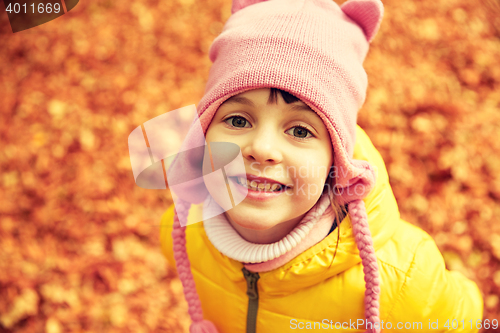 Image of happy little girl in autumn park