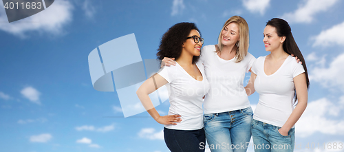 Image of group of happy different women in white t-shirts