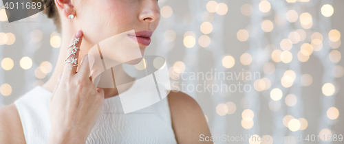 Image of close up of beautiful woman with ring and earring