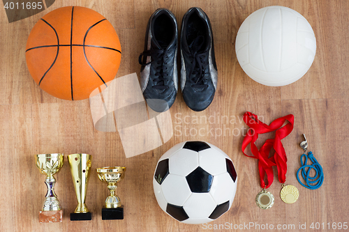 Image of sports balls, boots, cups, whistle and medals