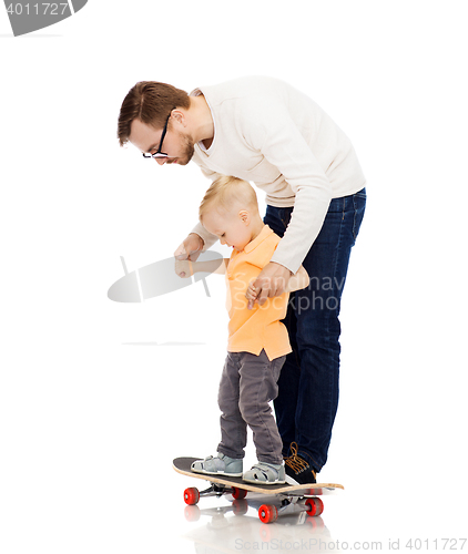 Image of happy father and little son on skateboard
