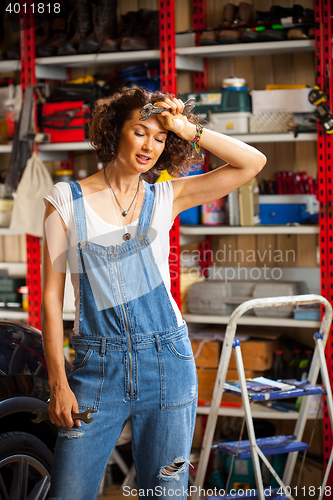 Image of portrait of a beautiful mechanic woman