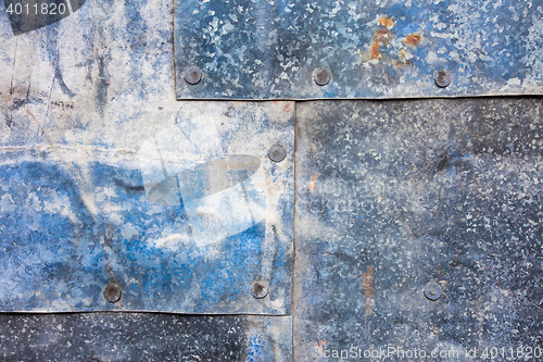 Image of Sheets of galvanized iron fastened by rivets