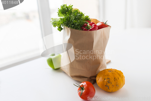 Image of basket of fresh ripe vegetables at kitchen