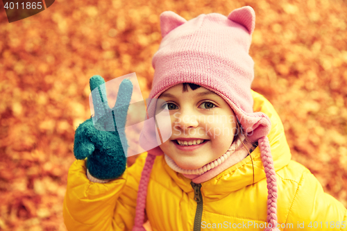 Image of happy little girl in autumn park