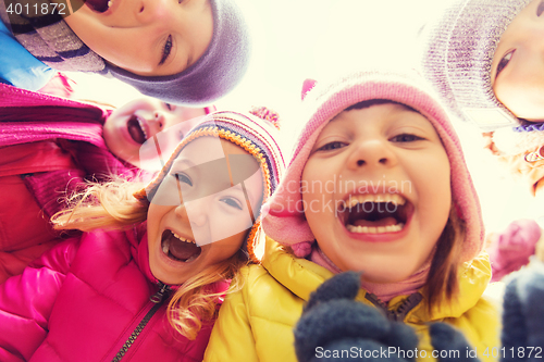 Image of group of happy children faces in circle