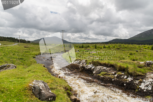 Image of view to river and hills at connemara in ireland