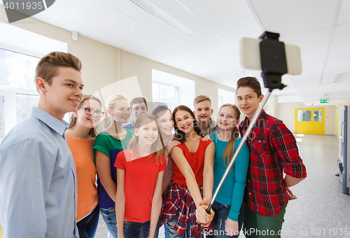 Image of group of students taking selfie with smartphone