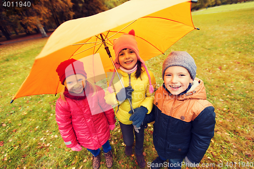 Image of group of happy children in autumn park