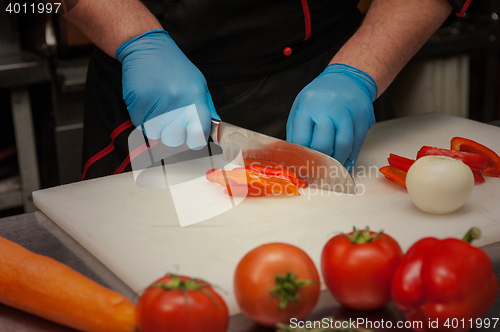 Image of Chef cutting vegetables