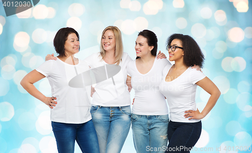 Image of group of happy different women in white t-shirts