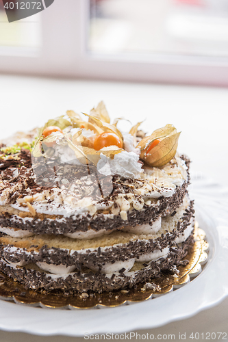 Image of cake with walnuts and physalis