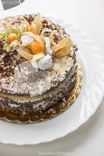 Image of cake with walnuts and physalis