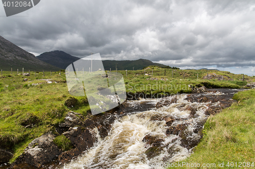 Image of view to river and hills at connemara in ireland