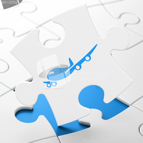 Image of Travel concept: Airplane on puzzle background