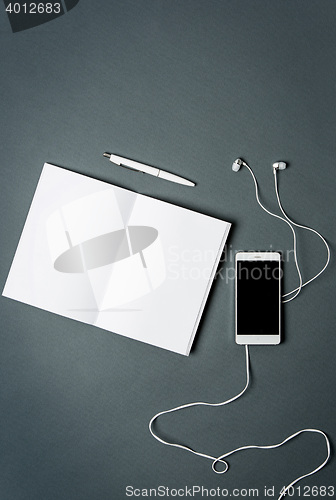 Image of Mock-up business notebook, phone. Gray background.